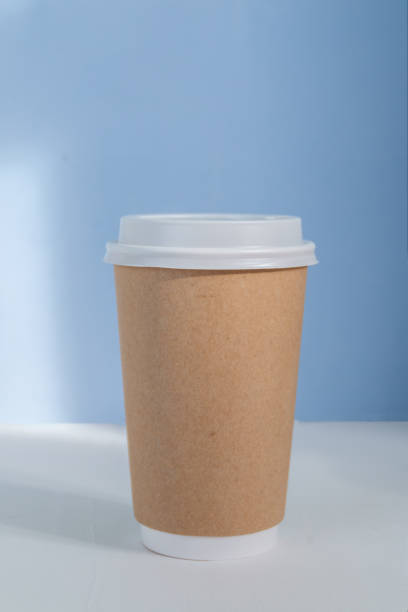 istock Paper cup to go against blue background 1346612799