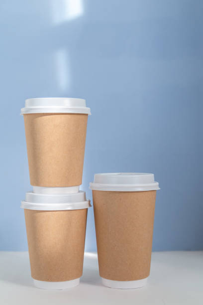 istock Paper cup to go against blue background 1346612827