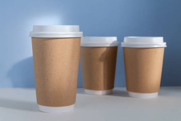 istock Paper cup to go against blue background 1346612835