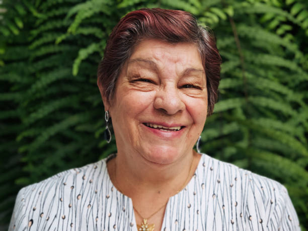 istock Elderly woman at home, looking happy 1346612995