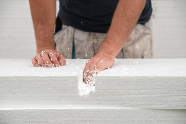 istock Worker cleaning cut in styrofoam 1346615804
