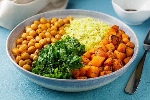 Homemade roasted chickpea with turmeric basmati rice, roasted butternut squash and kale, Chia seeds.