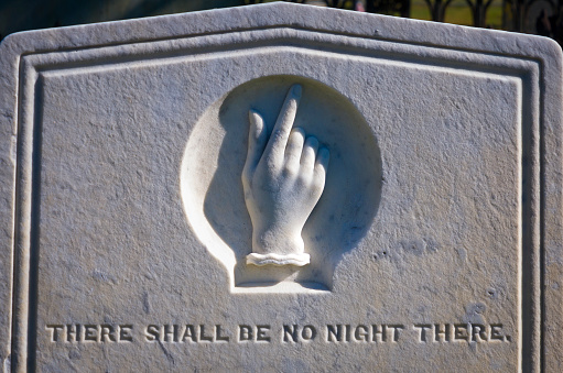 Ancient gravestone on Cape Cod depicting a hand pointing upward  and the words \