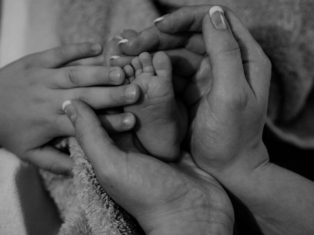 istock Hands and baby foot 1346620539
