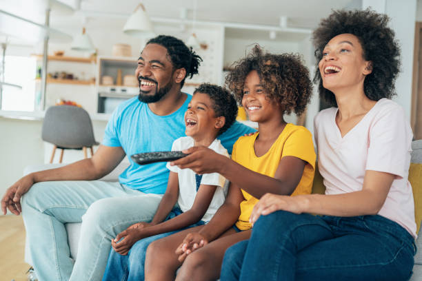 istock Family watching television 1346620578