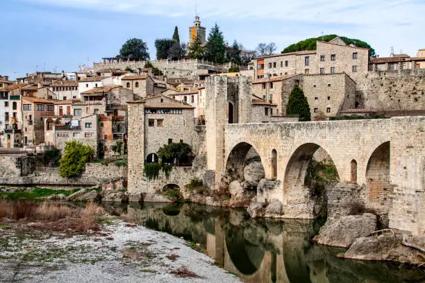 View of the medieval village of Besalú from the river, in Girona, Catalonia.