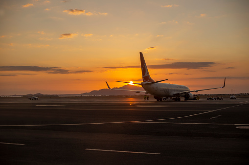 Air Plane take off on sunset
