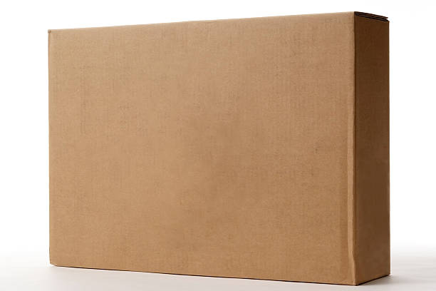 Isolated shot of blank cardboard box on white background Close-up shot of blank cardboard box isolated on white background. brown box stock pictures, royalty-free photos & images