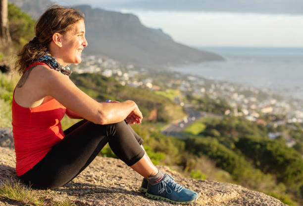 istock Woman with cerebral palsy looking at the view during a break from a run 1346628520