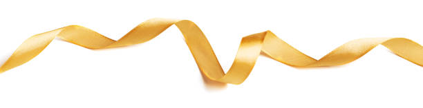 istock Wavy golden ribbon isolated on white background. 1346628864