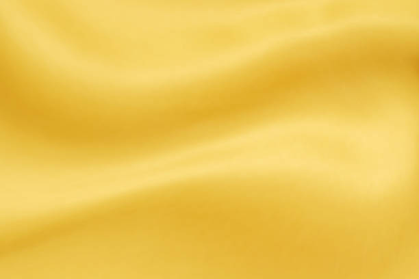 istock Abstract luxury gold fabric with soft wave texture background 1346635778