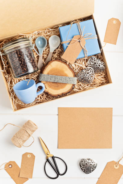 istock Preparing care package, seasonal gift box with plastic free, zero waste products for coffee lovers 1346636779