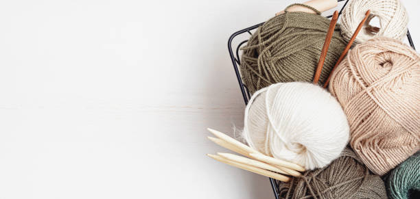 istock Craft hobby background with yarn in natural colors 1346636819