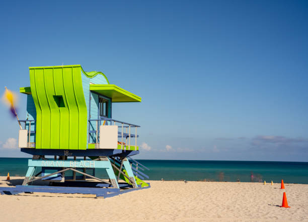 istock Lifeguard tower Miami Beach. Long exposure to blur ghost people 1346646448