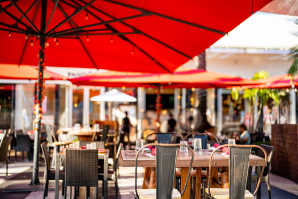 istock Restaurants with tables and chairs. Blurry people in background 1346646487