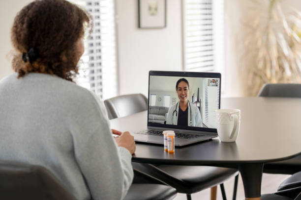 istock Patient Meeting Remotely with her Doctor 1346651714