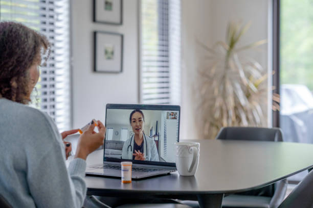istock Patient Meeting Remotely with her Doctor 1346651720