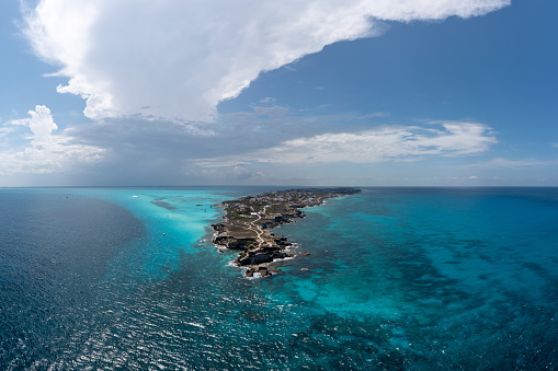 Aerial view of the clear blue waters around Punta Sur in Isla Mujeres, Mexico .