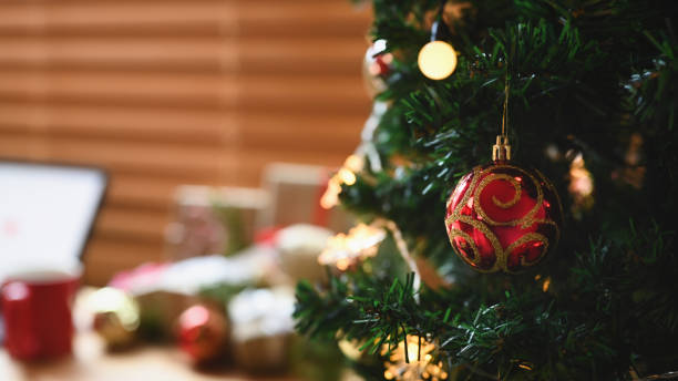 istock Red Christmas balls decorated on Christmas tree. 1346659999
