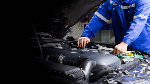 istock Car mechanic working on car engine, car maintenance concept. 1346661569