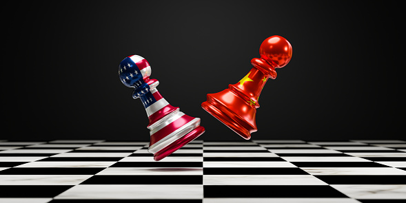 Battle chess on chess board  between China and USA for symbol of trade war and military conflict concept.