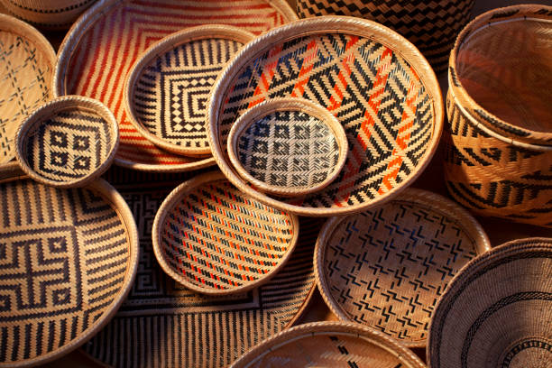 Baskets. Traditional handicraft products. Baskets are handmade and are colored using natural dyes. The designs are ethnic in origin. Handicraft products of Indigenous tribes in Brazil. craft product stock pictures, royalty-free photos & images