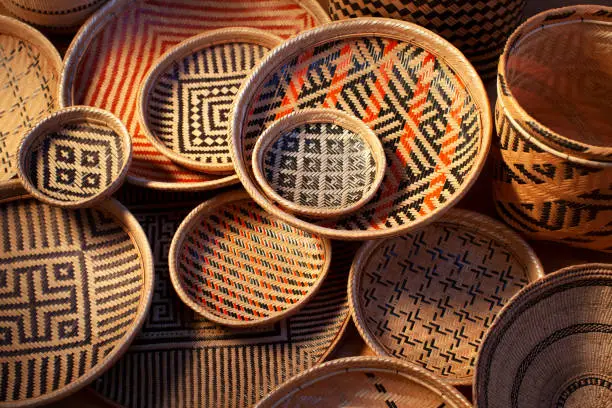Baskets are handmade and are colored using natural dyes. The designs are ethnic in origin. Handicraft products of Indigenous tribes in Brazil.