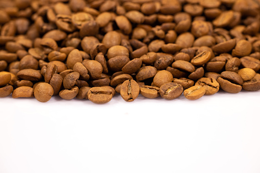 roasted coffee beans isolated in white background