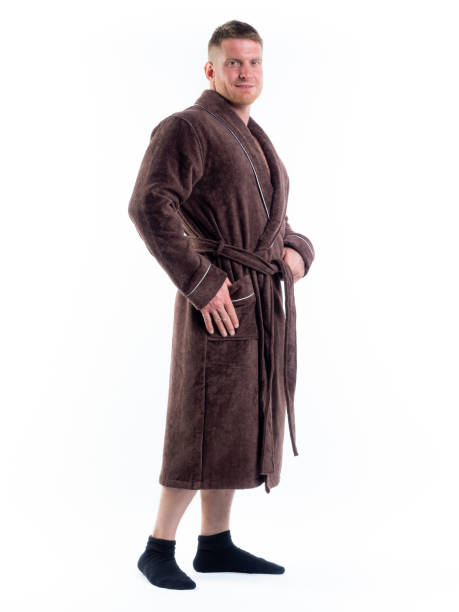 istock strong man in a Bathrobe on an isolated white background with a smile on his face. 1346667749