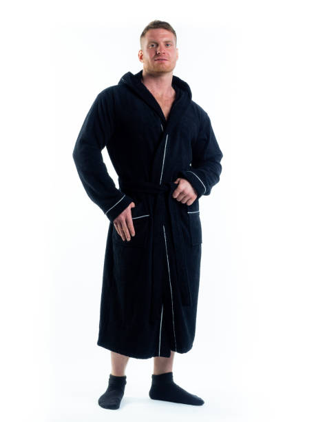 istock strong man in a Bathrobe on an isolated white background with a smile on his face. 1346667752