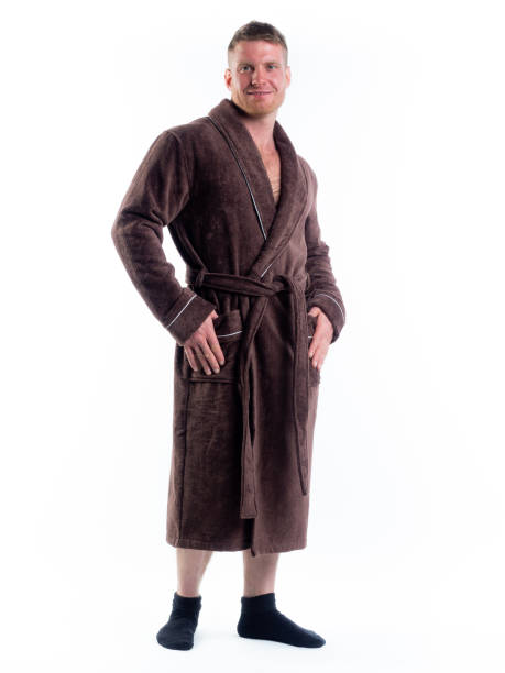 istock strong man in a Bathrobe on an isolated white background with a smile on his face. 1346667756