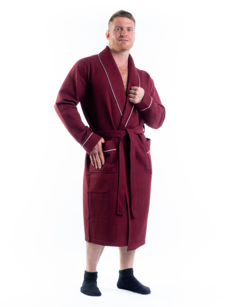 istock strong man in a Bathrobe on an isolated white background with a smile on his face. 1346667759