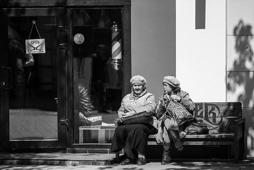 Saratov, Russia April 30, 2019 - Elderly women sit on a bench near a hairdresser