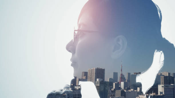 Silhouette of thinking woman and modern cityscape. Double exposure. Silhouette of thinking woman and modern cityscape. Double exposure. women issues stock pictures, royalty-free photos & images