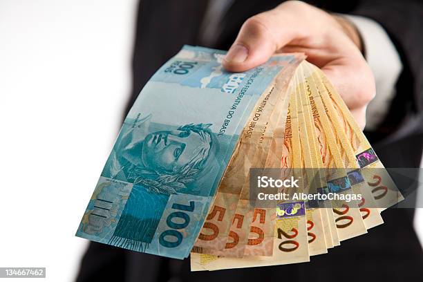 Business Man Showing You Money Stock Photo - Download Image Now - Currency, Brazilian Currency, Paper Currency