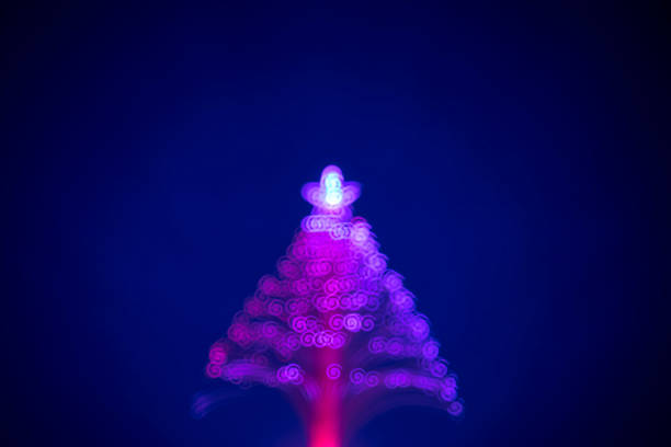 istock Christmas Tree (defocused) with spiral shaped bokeh 1346675501