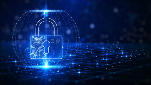 Cybersecurity and privacy protection are concepts in computer technology. The padlock is inside a transparent shield on the left-hand side. against a dark blue background. stock photo