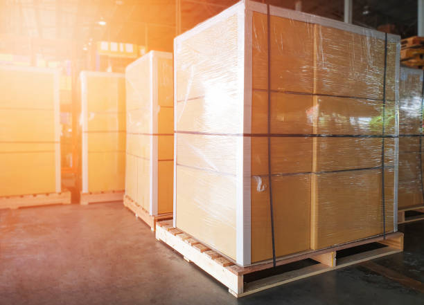 istock Package Boxes Wraaped Plastic Film on Pallets in Storage Warehouse. Supply Chain. Storehouse Cargo Shipment. Shipping Warehouse Logistics. 1346676847