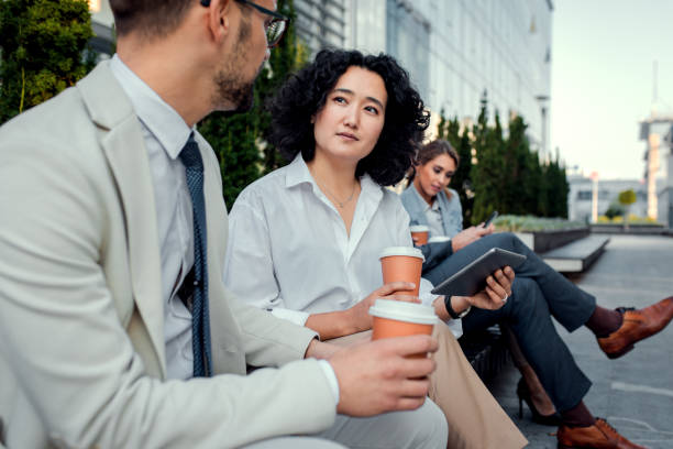 istock Group of coworkers having a coffee brake. 1346677004