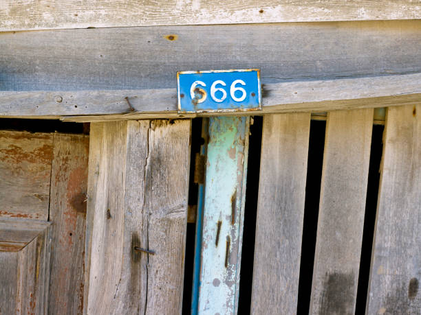 istock Number 666 on old wooden door 1346678695