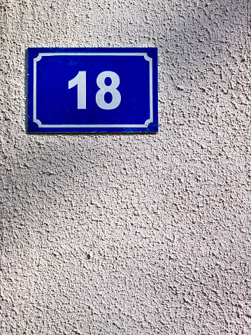 Number 18 sign on the wall