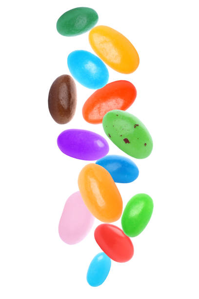 Set of delicious jelly beans falling on white background Set of delicious jelly beans falling on white background jellybean photos stock pictures, royalty-free photos & images