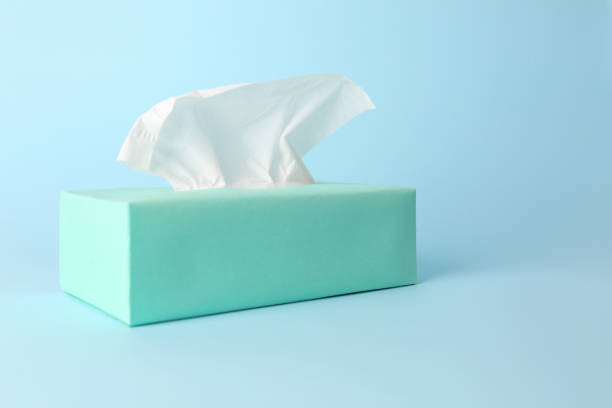 istock Box of paper tissues on light blue background 1346681523