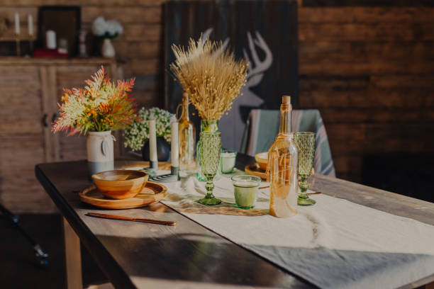 istock Cosy autumn interior decoration. Autumn table settings. Lights in bottle. 1346681721