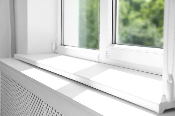 istock Closeup view of window with empty white sill 1346682257