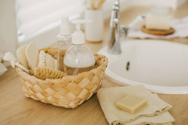 istock Kitchen interior with natural eco-friendly zero waste cleaning items: brushes, rugs, soap, spray and sponges in a wicker basket. 1346682629