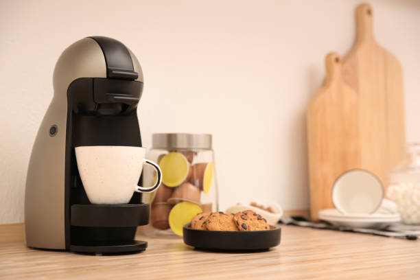 istock Modern coffeemaker on wooden countertop in kitchen 1346682652