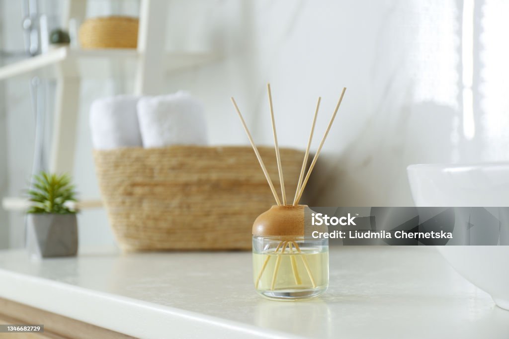 Reed air freshener on counter in bathroom Aromatherapy Diffuser Stock Photo