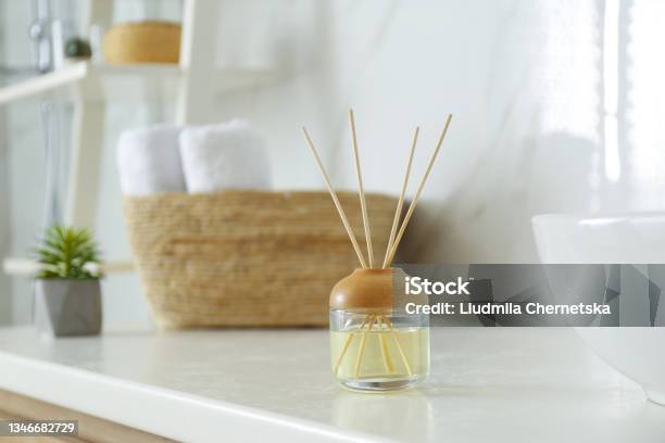 Reed Air Freshener On Counter In Bathroom Stock Photo - Download Image Now - Aromatherapy Diffuser, Bathroom, Essential Oil