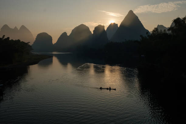 istock Li river on sunrise, man silhouette 1346683704